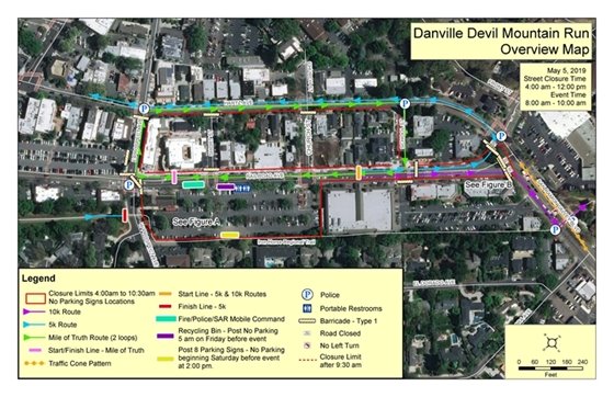 Street view of downtown Danville.  Angle is very high in the air, showing the roads and buildings. A light blue line shows where the 5k runners are going and a purple line shows where the 10k runners are going. In the lower left corner is a key for all of the markings on the map.  